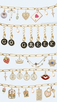 a group of charms with the word go greek on them